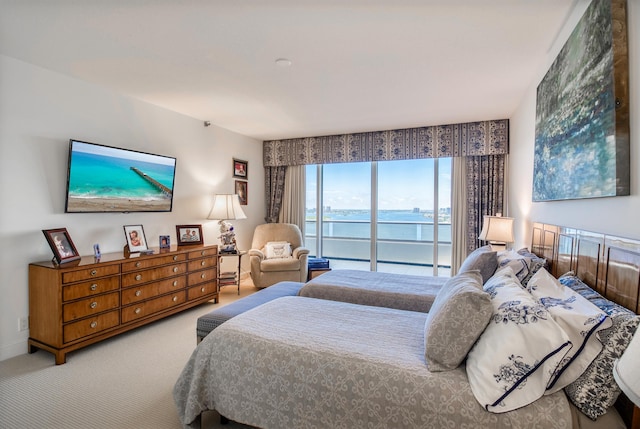 bedroom featuring access to outside and carpet flooring