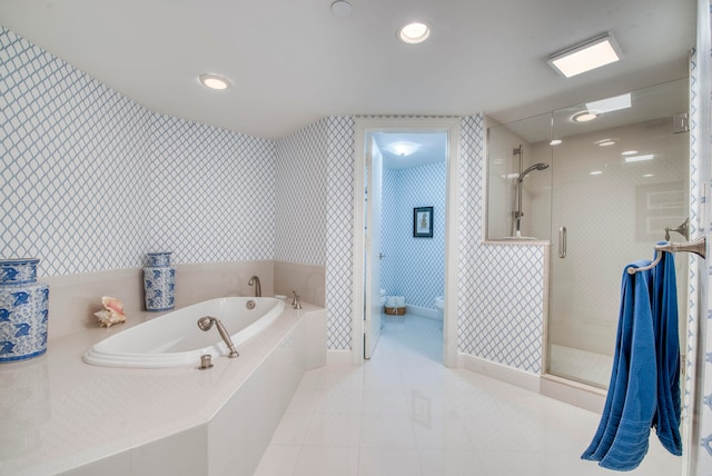 bathroom with tile patterned flooring and plus walk in shower