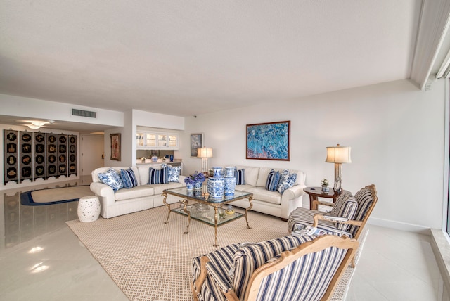 living room featuring a textured ceiling