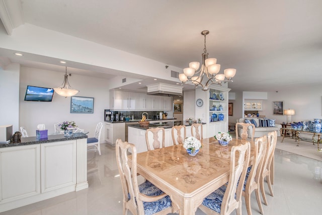 dining space featuring a chandelier and light tile patterned floors