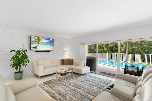 living room with brick wall