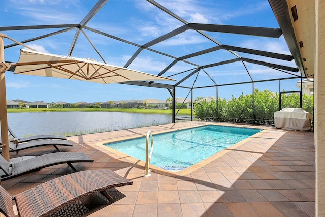 view of pool featuring a patio, a water view, area for grilling, and glass enclosure