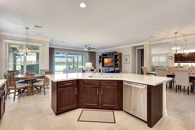 kitchen with hanging light fixtures, stainless steel dishwasher, ceiling fan with notable chandelier, and sink