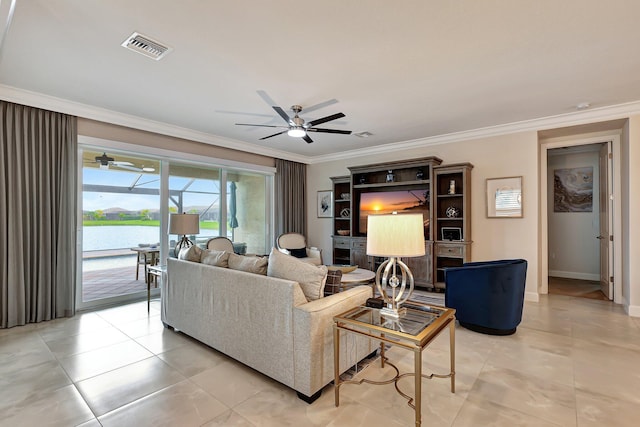 living room with ceiling fan, crown molding, and light tile patterned floors