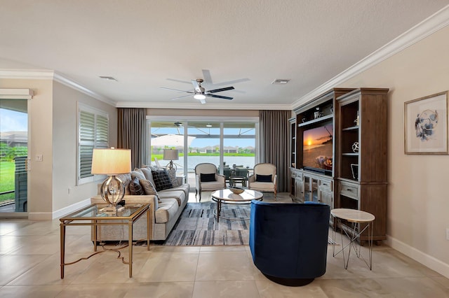 tiled living room featuring ornamental molding, ceiling fan, and a textured ceiling