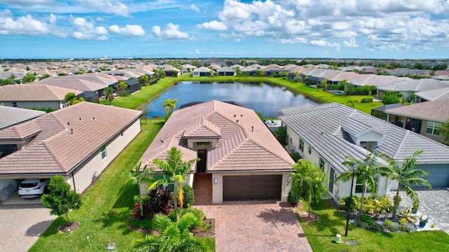 birds eye view of property with a water view