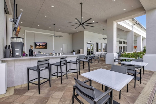 dining space with ceiling fan and a wealth of natural light