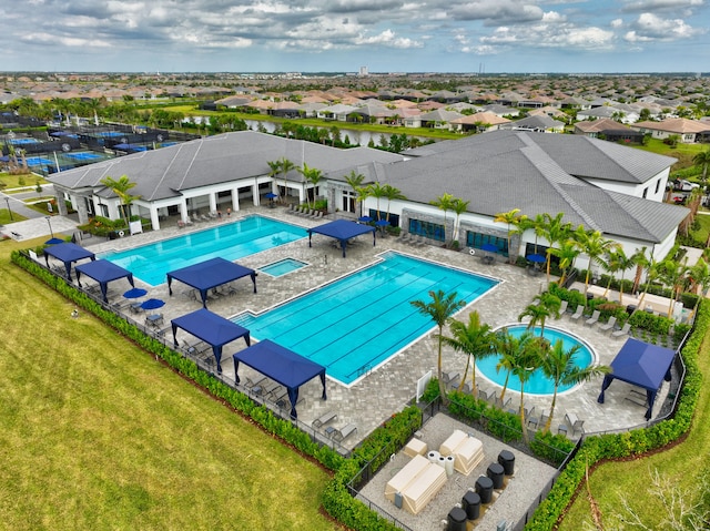 view of swimming pool with a patio area and a yard