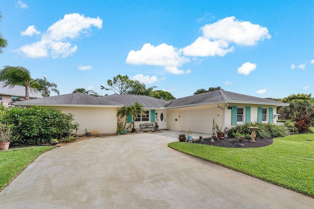 ranch-style home featuring a garage and a front lawn