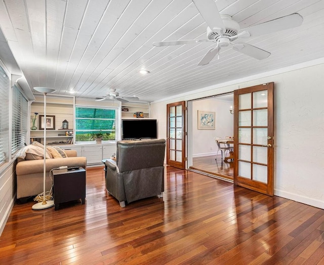 living room with ceiling fan, wood-type flooring, and wood ceiling