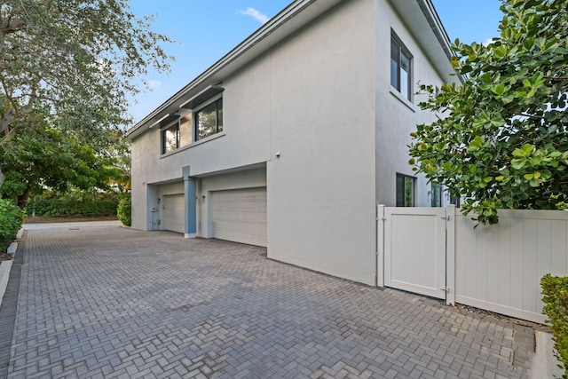 view of property exterior with a garage