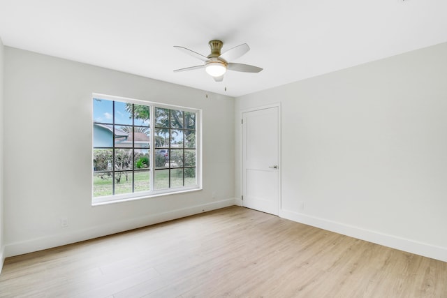 unfurnished room featuring light hardwood / wood-style flooring and ceiling fan