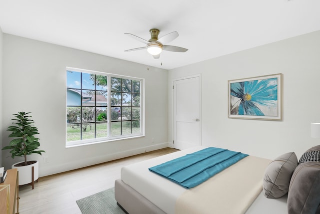 bedroom featuring light wood-type flooring and ceiling fan