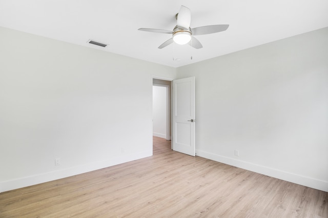 spare room featuring ceiling fan and light hardwood / wood-style flooring