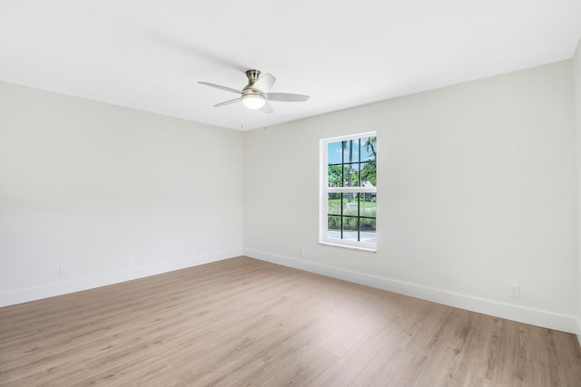 unfurnished room with ceiling fan and light wood-type flooring