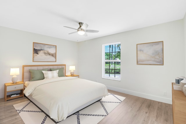 bedroom featuring ceiling fan and light hardwood / wood-style floors