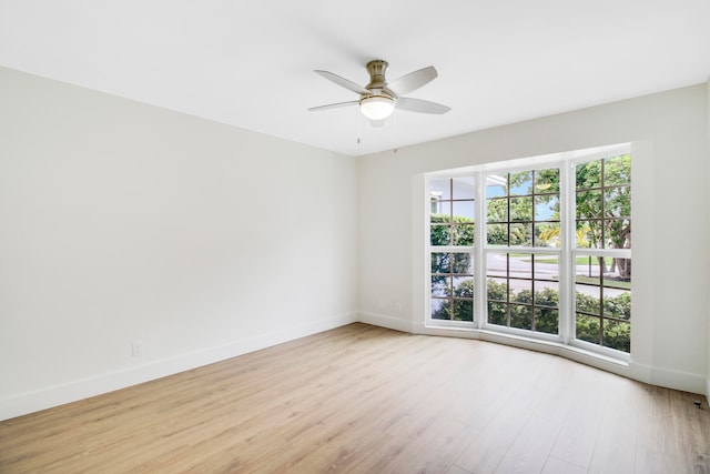 empty room featuring ceiling fan and light hardwood / wood-style floors