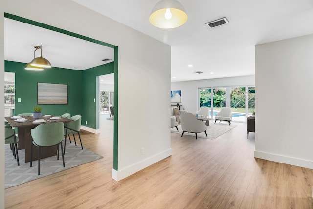 hall with light hardwood / wood-style flooring