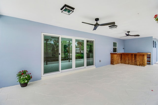 exterior space featuring ceiling fan