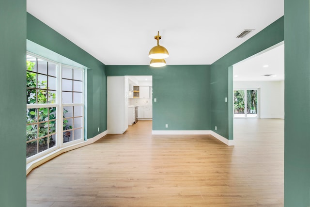 unfurnished room featuring light hardwood / wood-style floors