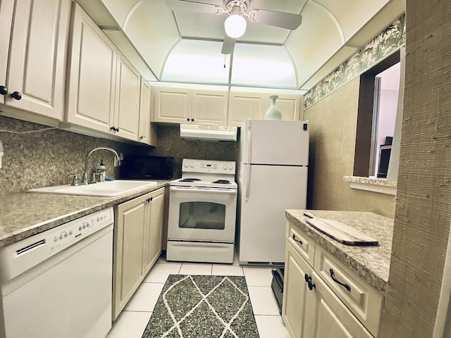 270 Tilford M, Deerfield Beach, FL 33442 - kitchen featuring white appliances, under cabinet range hood, light countertops, a sink, and light tile patterned floors