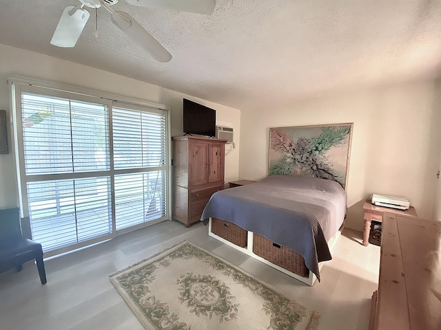 270 Tilford M, Deerfield Beach, FL 33442 - bedroom featuring access to exterior, a textured ceiling, and ceiling fan