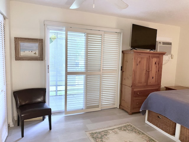 270 Tilford M, Deerfield Beach, FL 33442 - bedroom with a wall mounted air conditioner, access to exterior, and a ceiling fan