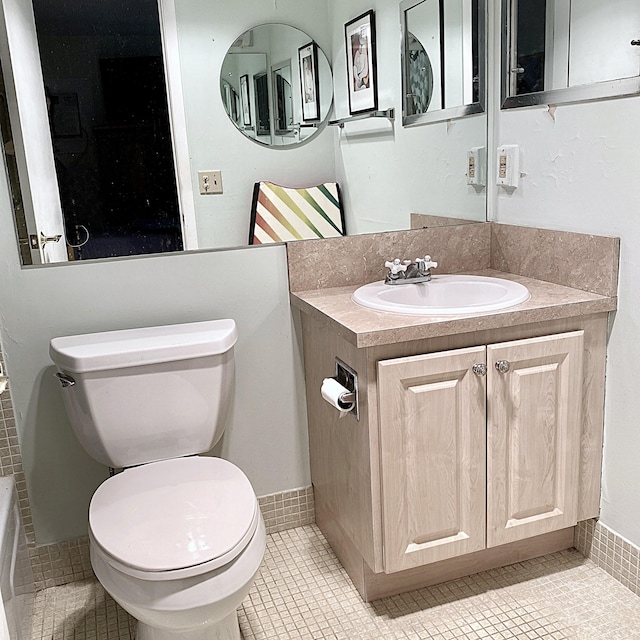 270 Tilford M, Deerfield Beach, FL 33442 - full bathroom featuring tile patterned floors, toilet, vanity, and a bathtub