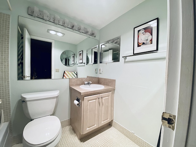 270 Tilford M, Deerfield Beach, FL 33442 - full bathroom with vanity, toilet, tile patterned flooring, baseboards, and shower / washtub combination