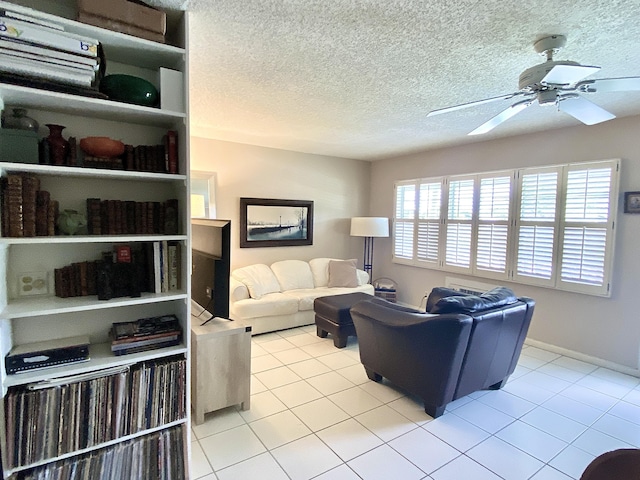 270 Tilford M, Deerfield Beach, FL 33442 - living room with light tile patterned floors, a ceiling fan, and a textured ceiling