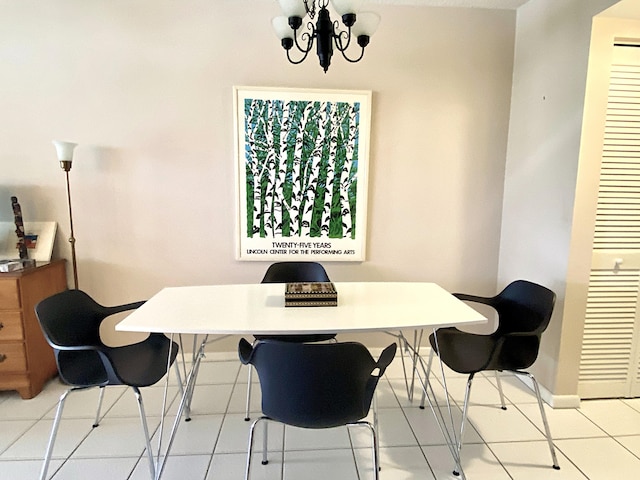 270 Tilford M, Deerfield Beach, FL 33442 - tiled dining room with baseboards and a chandelier