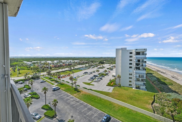 drone / aerial view with a water view and a view of the beach