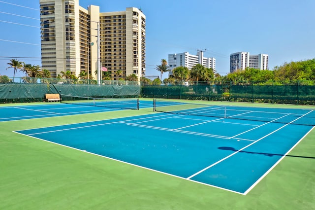 view of tennis court featuring basketball court