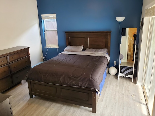 bedroom featuring light wood-type flooring