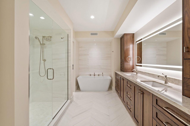 bathroom with vanity, tile walls, and plus walk in shower