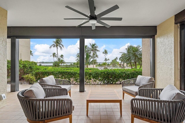 sunroom with plenty of natural light and ceiling fan