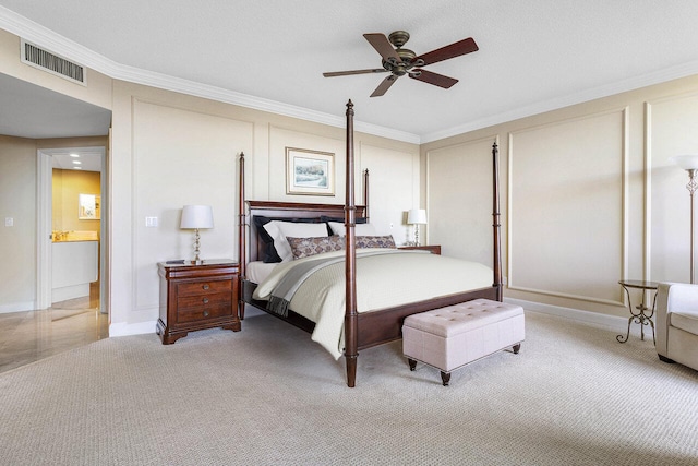 carpeted bedroom featuring ceiling fan and ornamental molding