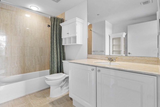 full bathroom featuring toilet, vanity, and shower / bath combination with curtain