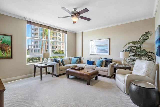 living room with ceiling fan, crown molding, light carpet, and a textured ceiling