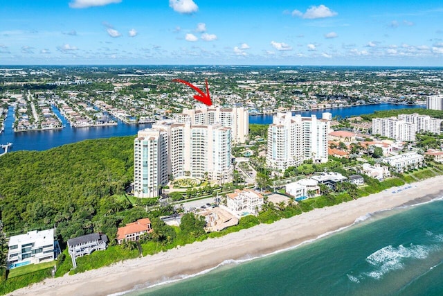 bird's eye view with a water view and a view of the beach