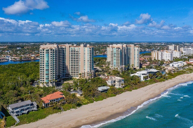 aerial view with a water view and a view of the beach