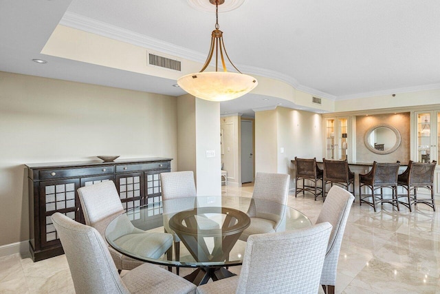 dining room with crown molding