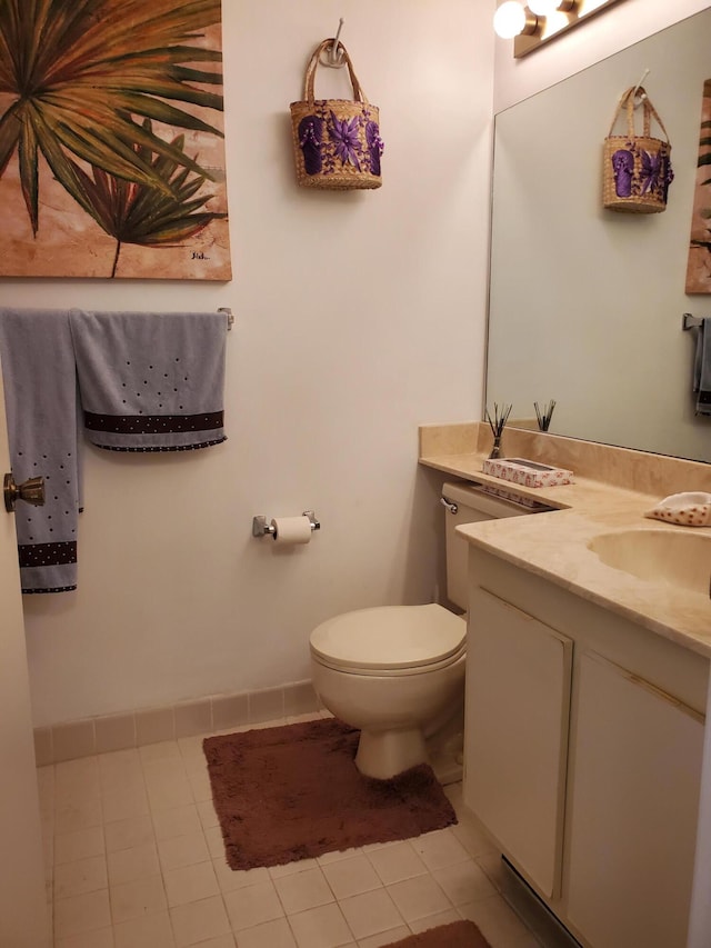 bathroom featuring vanity, toilet, and tile patterned floors