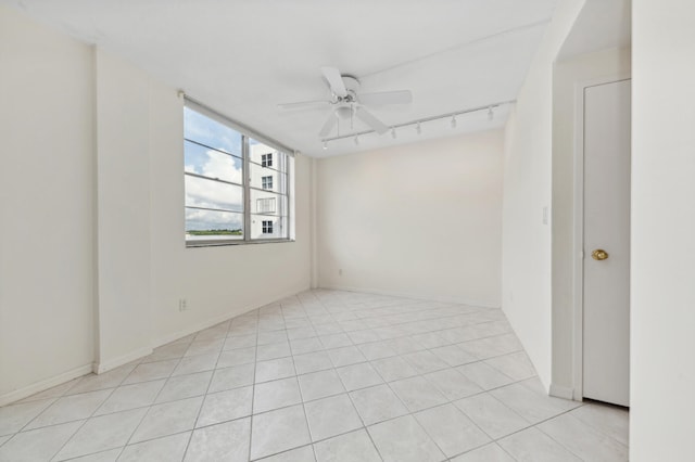 unfurnished room with light tile patterned flooring and ceiling fan