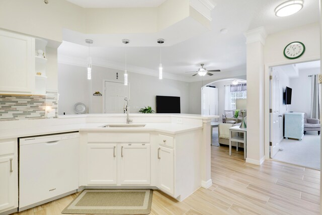 kitchen featuring pendant lighting, sink, white cabinets, white dishwasher, and ceiling fan