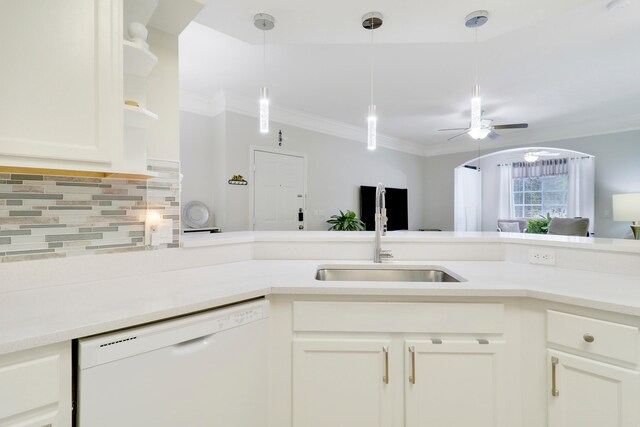 kitchen featuring ceiling fan, white dishwasher, sink, backsplash, and white cabinetry