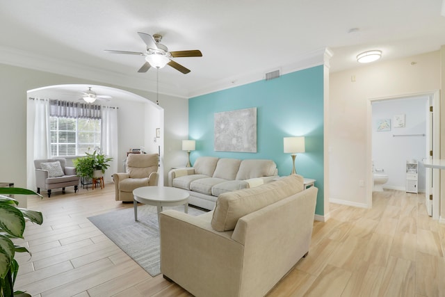 living room with ceiling fan, light hardwood / wood-style flooring, and crown molding