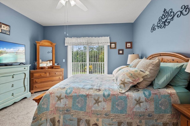 carpeted bedroom featuring access to outside and ceiling fan