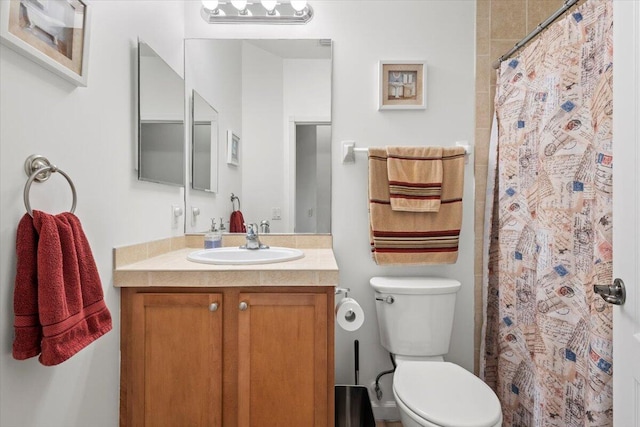 bathroom with vanity, toilet, and a shower with curtain