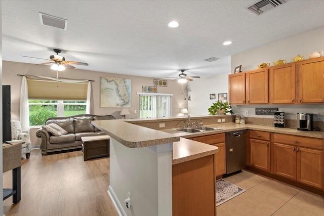 kitchen with dishwasher, light hardwood / wood-style flooring, sink, and kitchen peninsula